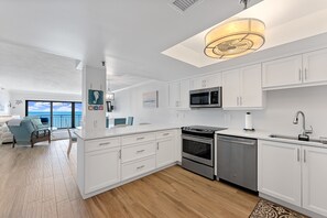 Cook in comfort in the updated kitchen, complete with sleek stainless steel appliances and everything you need for your beach getaway