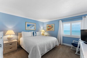 Wake up to the sound of the waves in the oceanfront master bedroom, featuring a king bed and stunning views of the Atlantic Ocean