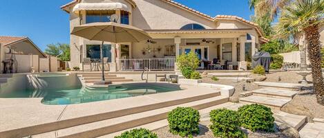 View of the house from the lake.  We’ve since added 4 palm trees