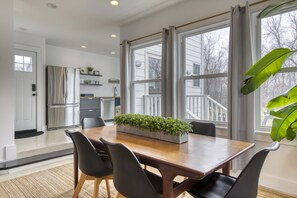 dining table with view into kitchen