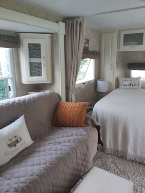 Queen bed at end of unit