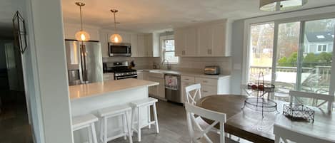 Fully renovated kitchen- new appliances, quartz counter tops, farmer's sink.