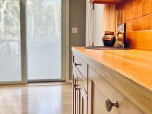 Lovely whitewash cabinets, sliders to deck with heater, large French door fridge