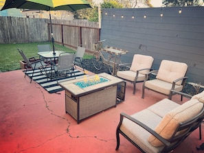 Backyard with outdoor furniture & BBQ grill