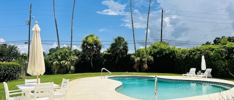 Fun private pool with grills, tables and 10 chairs, lounge chairs and fire pit. 