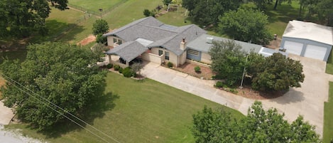 Aerial view of the property and surrounding area