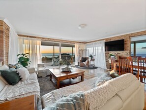 Sink into the plush sofas and enjoy the ambiance of our beautiful living room. #comfortandstyle #vacationrental