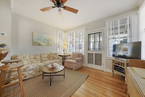 LIVING WITH FLATSCREEN TV AND FRONT PORCH ACCESS