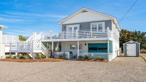 Outside there is plenty of parking.The blue garage door has been replaced with white siding.