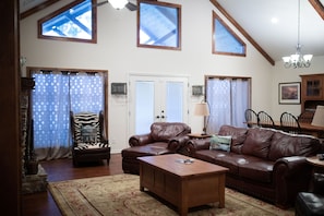 Living room w/ access to back deck / porch