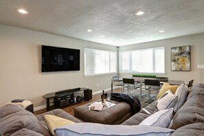 Big 65" LED TV with Long High End Glass Dining Table that can easily sit 10