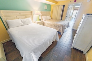 - Sleep in comfort with two cozy queen size beds, fresh linens, and a relaxing atmosphere - Thoughtfully designed with soft lighting, elegant headboards, and a spacious layout - Wake up refreshed and step out onto the balcony to take in the ocean breeze
