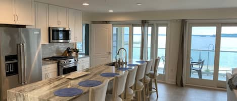 Gorgeous kitchen w Spectacular views of bay.  Sliders go out to ex-large balcony