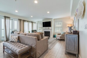 Professionally decorated.  Living Area looks out over bay.  Gas fireplace & TV.