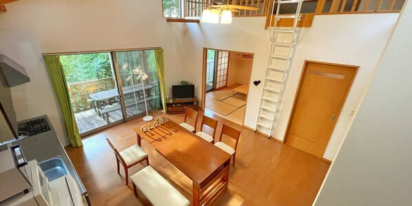 Bright dining with high ceiling