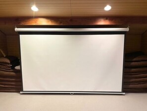 A screen is installed in the loft.