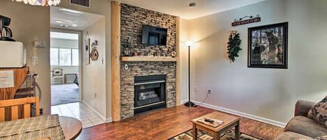 Living room has pergo flooring. 