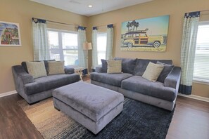 Overstuffed sofa and chair perfect for relaxing after a day on the beach