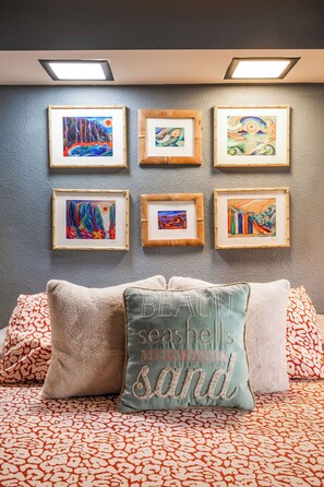 Your King sized bed with local artist mural. The waves will sing you a lullaby!