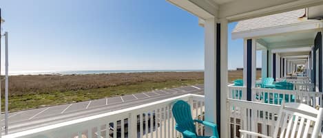 Private balcony off master bedroom with a beach view