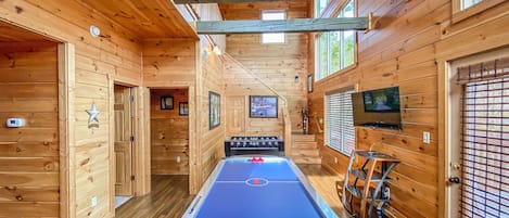 Game room with Air Hockey and Foosball Tables with Roku TV