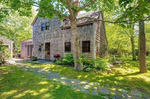 Side entrance with easy access to private yard and outdoor BBQ