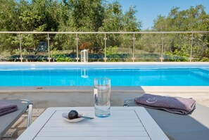 Private pool with sunbeds