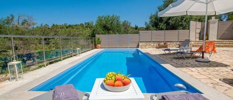 Private pool with outdoor area