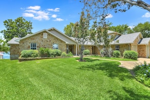 Spacious front yard with room to park boat trailer on other side