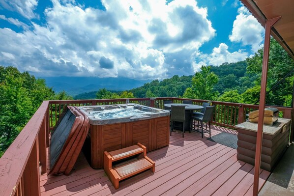 Soak in a hot tub with serene Mount LeConte views. Relaxation awaits!