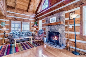 The living room is spacious and comfortable; the fireplace is nice in winter.