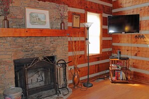 Wood burning fireplace, TV with cable, and a few books for your enjoyment.