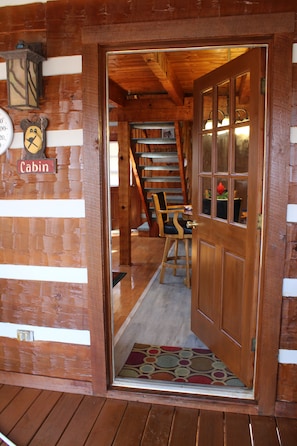 Looking inside from the back deck, next to the hot tub.