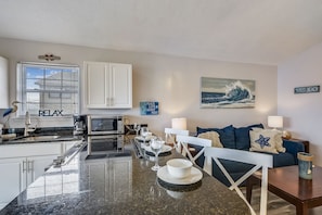 Living Area - Bar Seating - Fully Stocked Kitchen