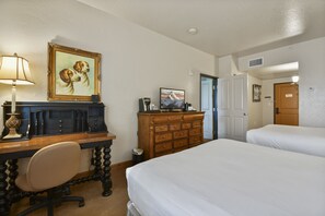 Guest bedroom with work space for travelers who need to work during their stay