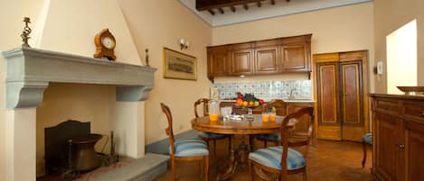 Living room with kitchen, dining and seating areas