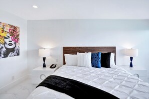 Master bedroom, king bed, tv, master bathroom ,balcony access, walk in closet