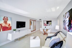 Dining area, living room, balcony access, Tv
