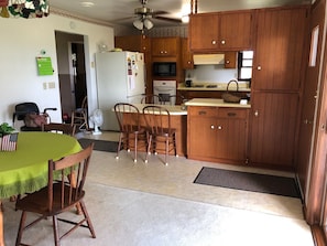 Great gathering space with kitchen and dining areas visible to each other.