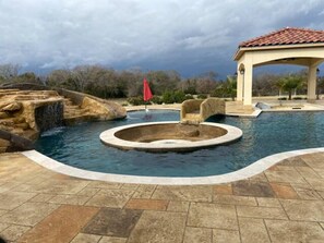 Pool slide area and sunken gas firepit. 