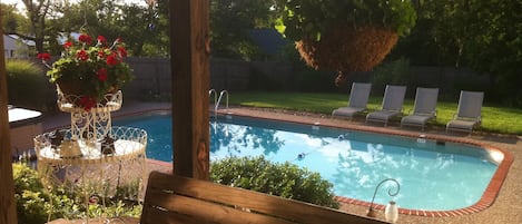 Back yard fenced in swimming pool.  This pool does have a deep end.  