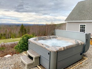 brand new 6-person hot tub with easy to remove retractable cover
