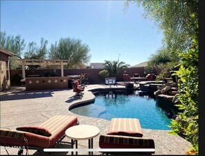 Outside Oasis!  Oversized heated pool and backyard for your entertainment. 