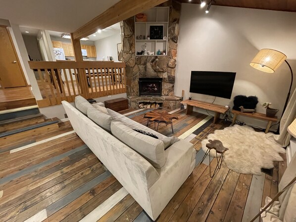 Living room with wood-burning fireplace