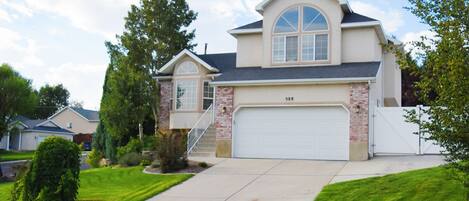 private home with garage and RV parking next to house available to guests