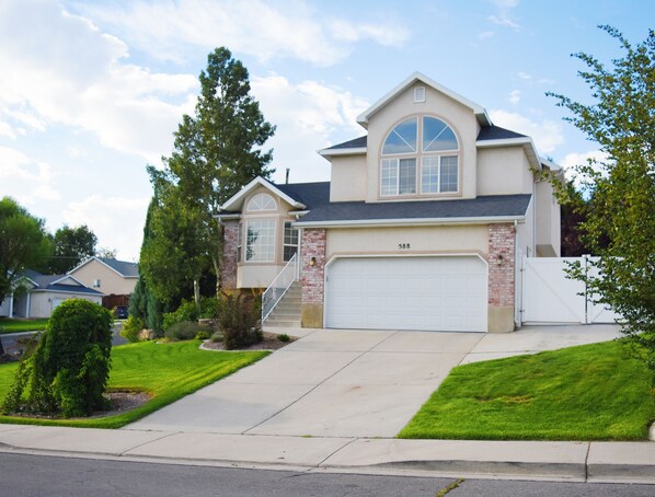private home with garage and RV parking next to house available to guests
