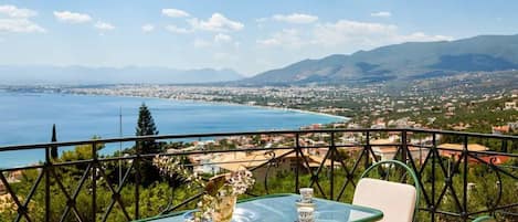 Savor Kalamata's scenic vista from the comfort of our patio