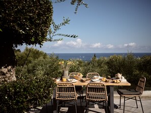 Morning haze of summer mists sneak out of the villa and cherish breakfast.