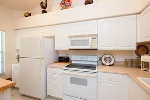 Fully stocked kitchen...refrigerator w/ ice maker, dishwasher, oven/stove, microwave, coffee pot, toaster and toaster oven.