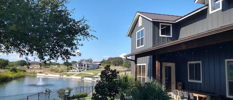 Back yard view of pool, covered patio and cove